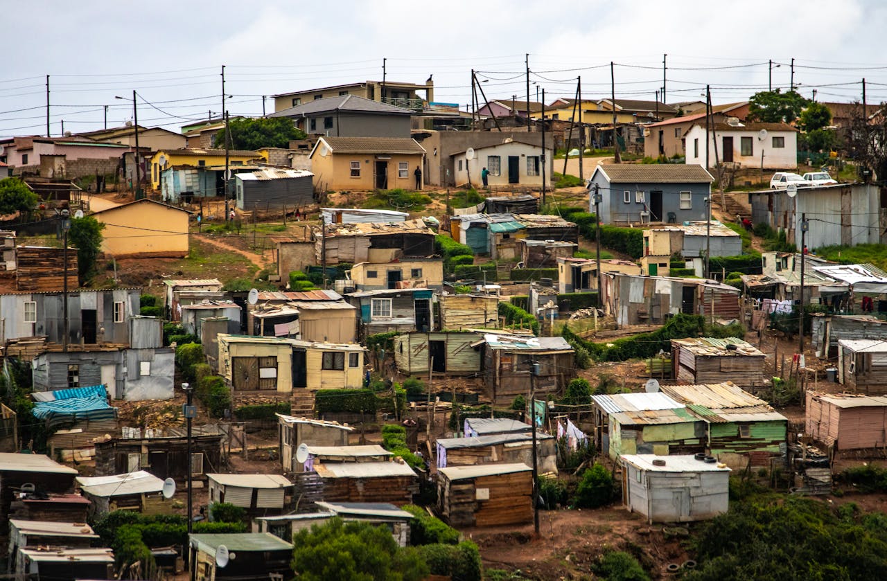 services-05 Captivating aerial photo showcasing a densely packed informal housing settlement.